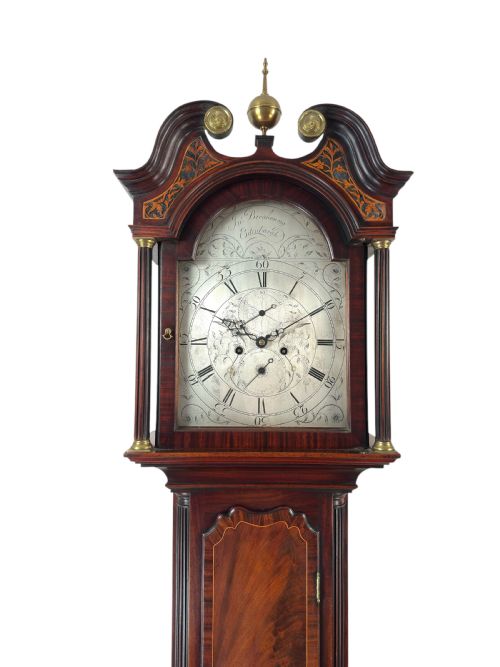 fig 1. A Scottish Georgian flame mahogany longcase clock featuring a swan-neck pediment, fluted quarter columns, and an engraved arched dial signed by John Breakenrig of Edinburgh.