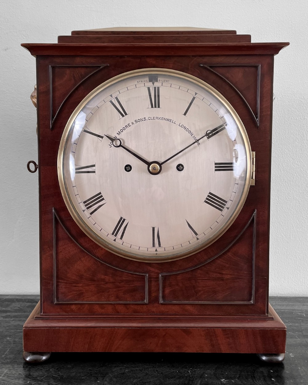 Chamfer top bracket clock by Moore & Sons of London