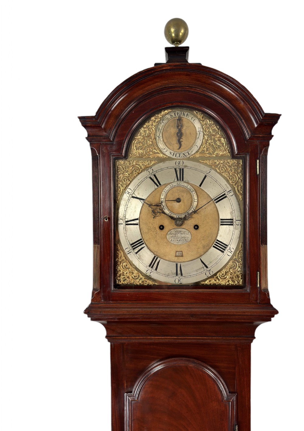 A Georgian flame mahogany longcase clock featuring an arched brass dial with silvered chapter ring, subsidiary dials, and a brass ball finial atop the hood. View II