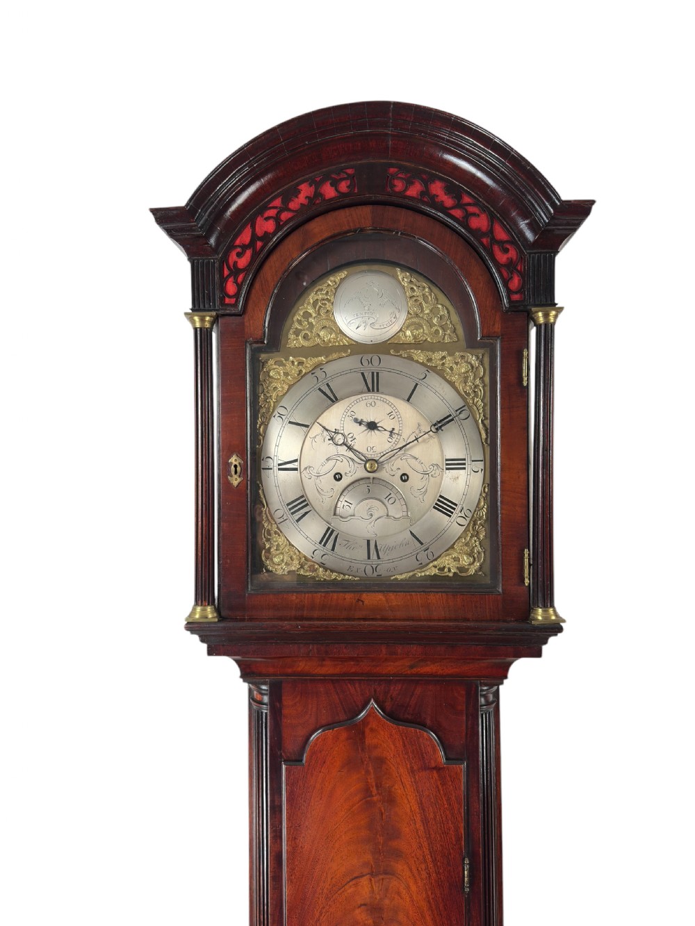 An eighteenth-century Georgian mahogany longcase clock featuring an arched hood with fluted columns and a silvered brass dial. View II