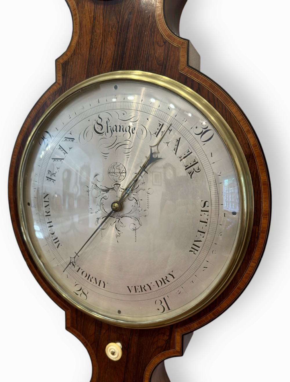 A vertical Regency rosewood banjo clock barometer featuring an inlaid wooden case, top hygrometer, thermometer tube, central clock dial, and large silvered barometer dial. View III