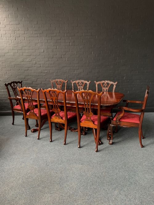 A CHIPPENDALE STYLE TWIN PEDESTAL TABLE EIGHT CONFORMING CHAIRS - ADDITIONAL PHOTO 1