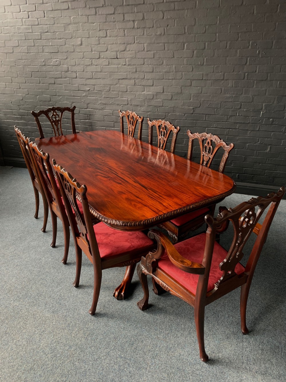 A Chippendale Style Twin Pedestal Table & Eight Conforming Chairs