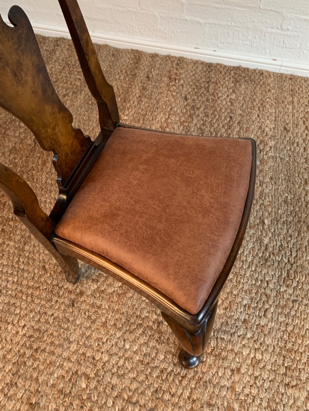Set of six Queen Anne style burr walnut dining chairs with vasiform splat backs, padded brown fabric seats, and cabriole legs. View VIII