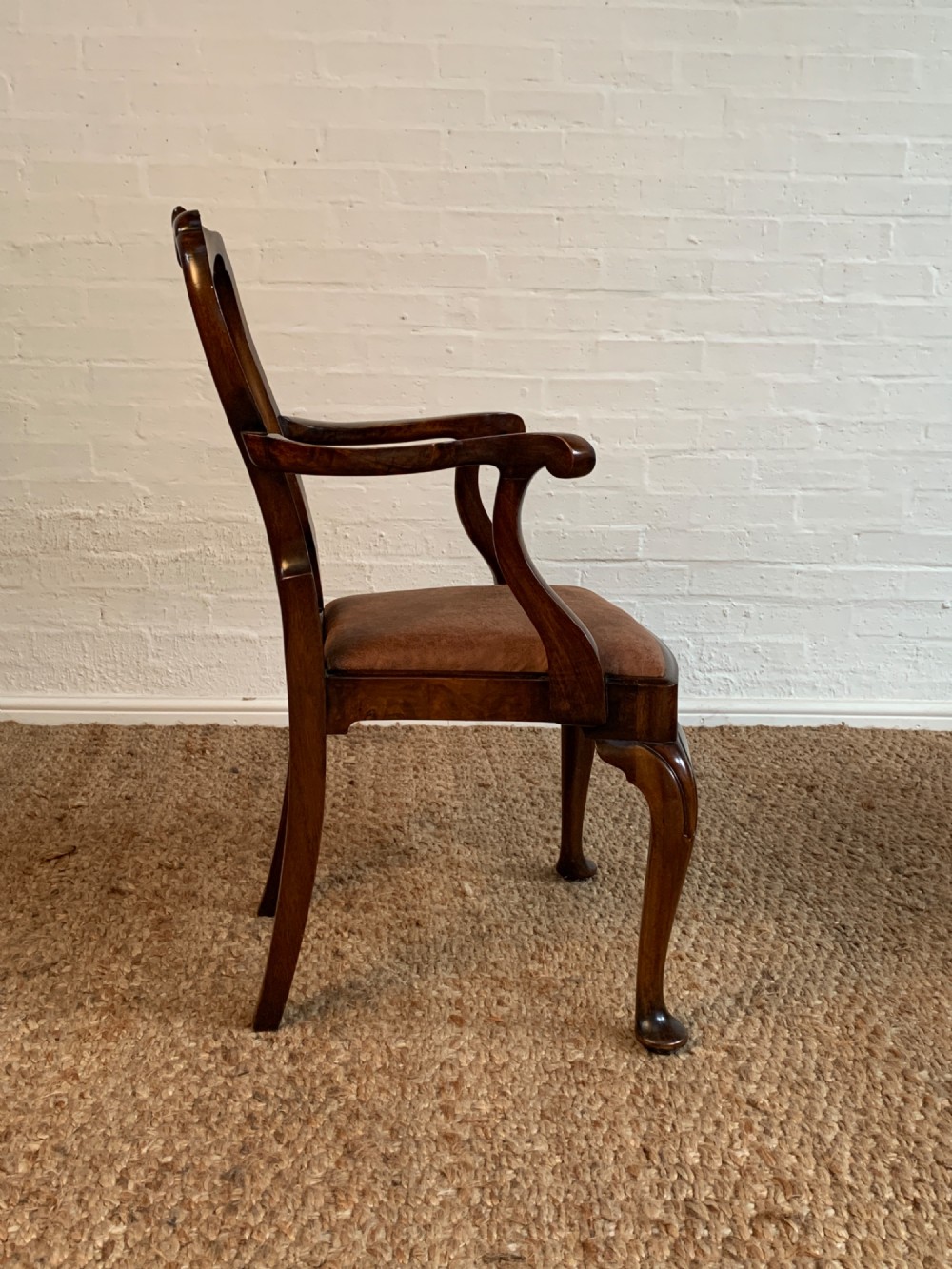 Set of six Queen Anne style burr walnut dining chairs with vasiform splat backs, padded brown fabric seats, and cabriole legs. View IX