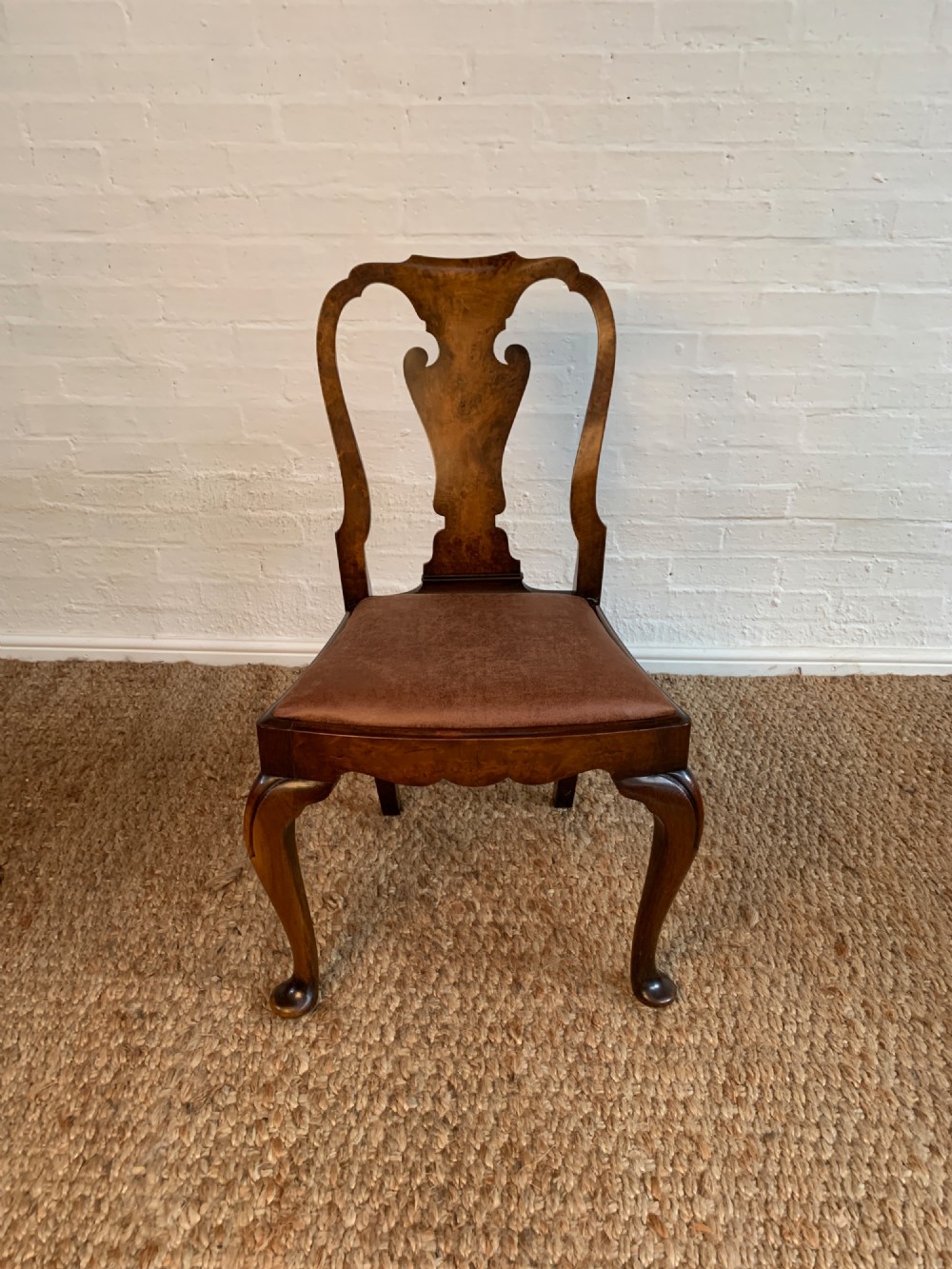 Set of six Queen Anne style burr walnut dining chairs with vasiform splat backs, padded brown fabric seats, and cabriole legs. View XI
