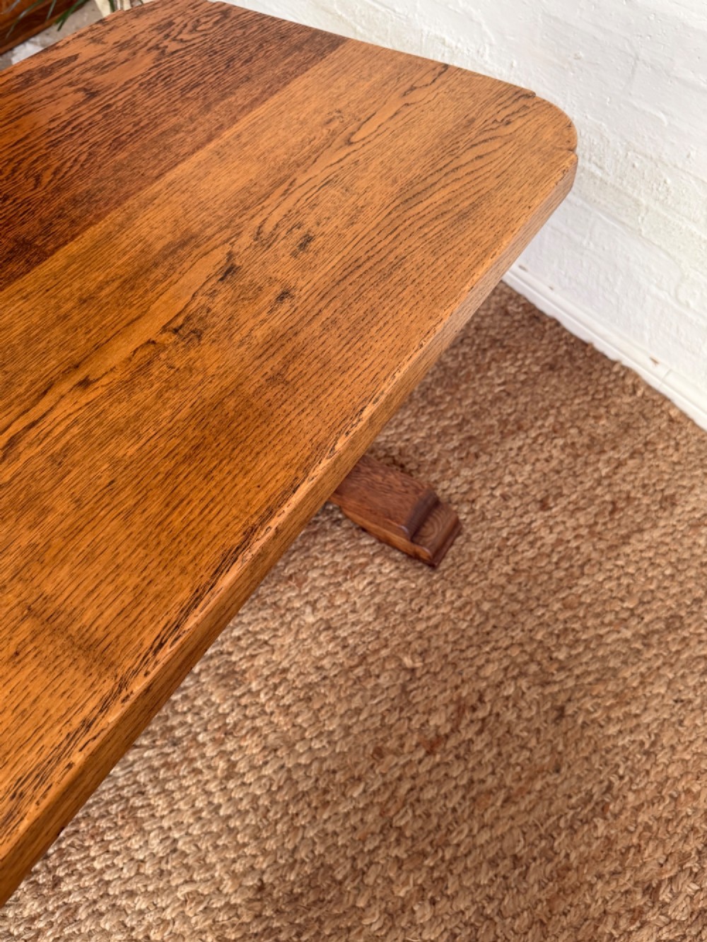 A small solid oak refectory style dining table featuring bulbous turned baluster legs and a floor-level central stretcher. View V