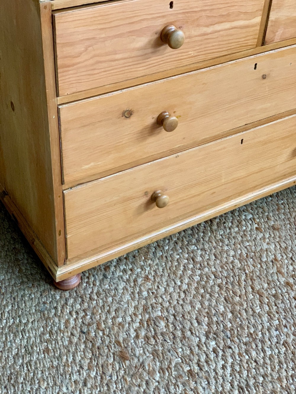 A two-piece late Victorian stripped pine dresser featuring a two-door upper cupboard and a base with two short over two long drawers with turned knobs. View V
