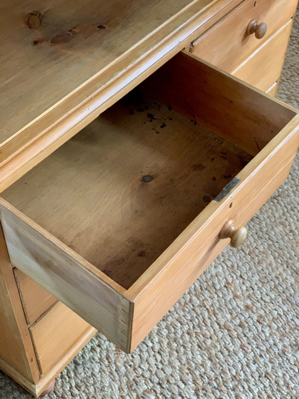 A two-piece late Victorian stripped pine dresser featuring a two-door upper cupboard and a base with two short over two long drawers with turned knobs. View VII