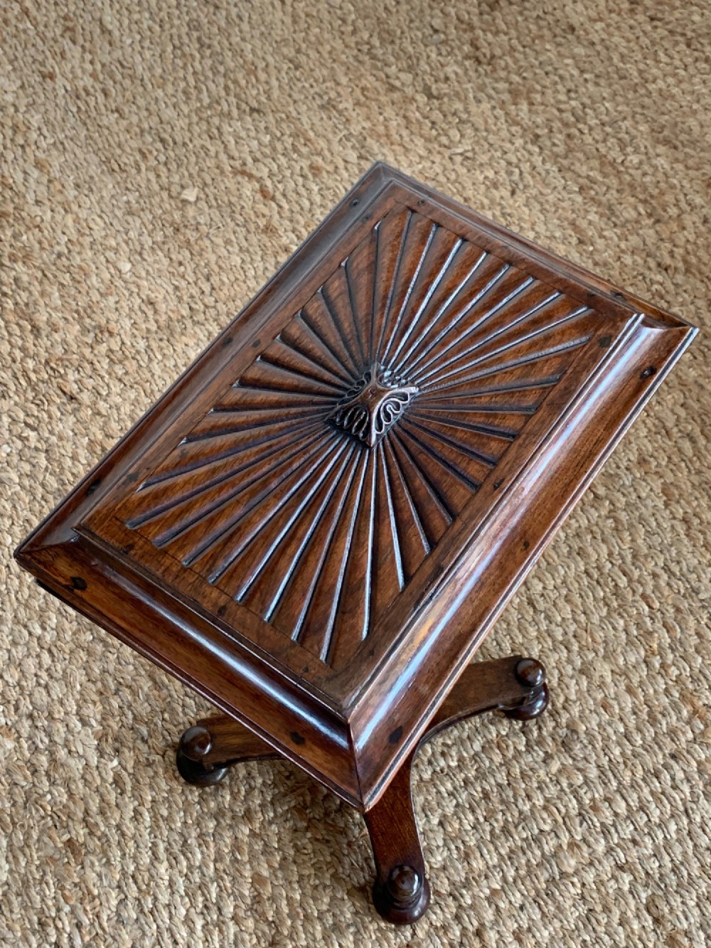 A dark rosewood William IV work table featuring a sunburst carved caddy top and side panels supported by a turned column pedestal and quadform base. View III