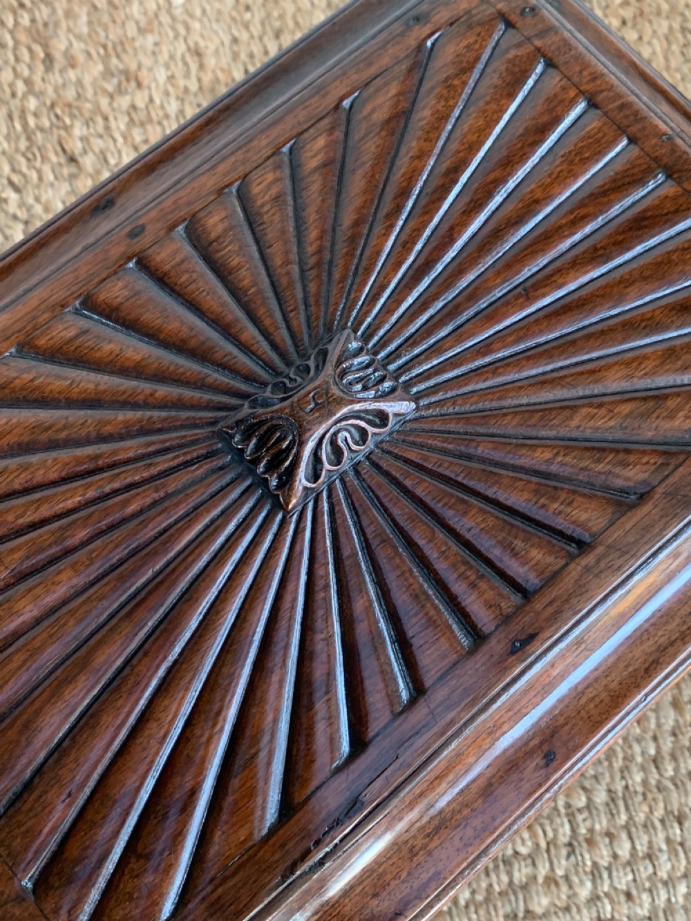 A dark rosewood William IV work table featuring a sunburst carved caddy top and side panels supported by a turned column pedestal and quadform base. View IV