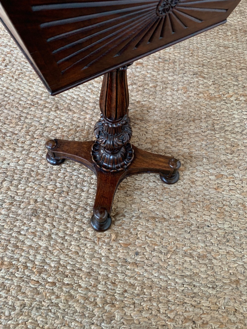 A dark rosewood William IV work table featuring a sunburst carved caddy top and side panels supported by a turned column pedestal and quadform base. View VI