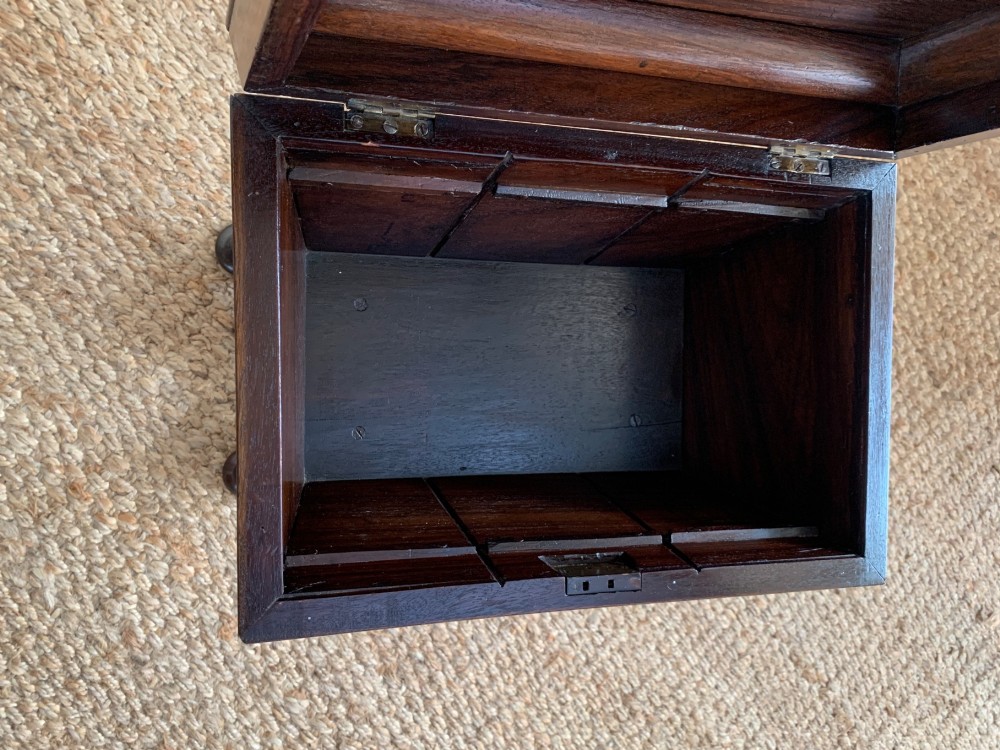 A dark rosewood William IV work table featuring a sunburst carved caddy top and side panels supported by a turned column pedestal and quadform base. View VII