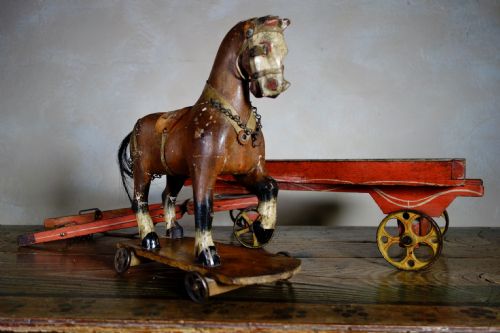 a decorative antique 19th century painted polychrome folk carved pull horse toy - CATEGORY: ANTIQUE MISCELLANEOUS - DATED 19TH CENTURY
