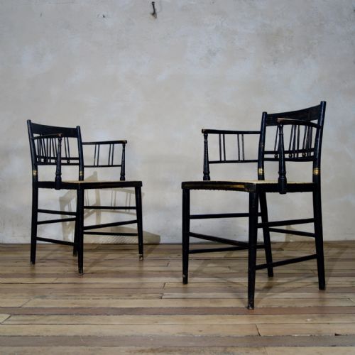 a pair of regency 19th century ebonized gilded open arm chair caned - CATEGORY: ANTIQUE CHAIRS - DATED REGENCY