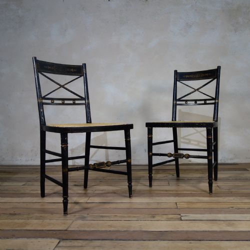 a pair of regency ebonised and caned side chairs - CATEGORY: ANTIQUE CHAIRS - DATED REGENCY