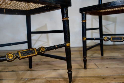 A PAIR OF REGENCY EBONISED AND CANED SIDE CHAIRS - ADDITIONAL PHOTO 4