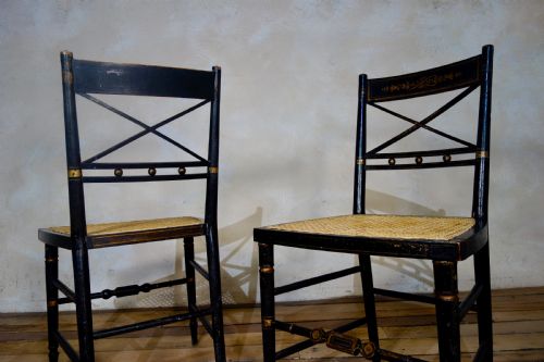 A PAIR OF REGENCY EBONISED AND CANED SIDE CHAIRS - ADDITIONAL PHOTO 6