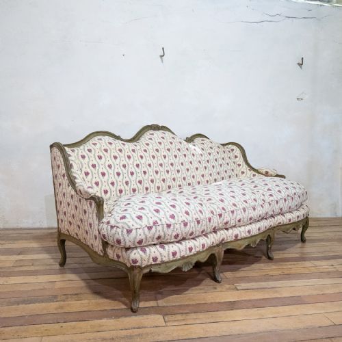 A LOUIS XV PAINTED CANAP OREILLES SERPENTINE SHAPED FEATHER SOFA SETTEE