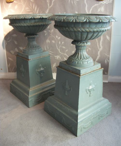 pair of elegant cast iron urns on plinths - CATEGORY: ANTIQUE MISCELLANEOUS - DATED 1900