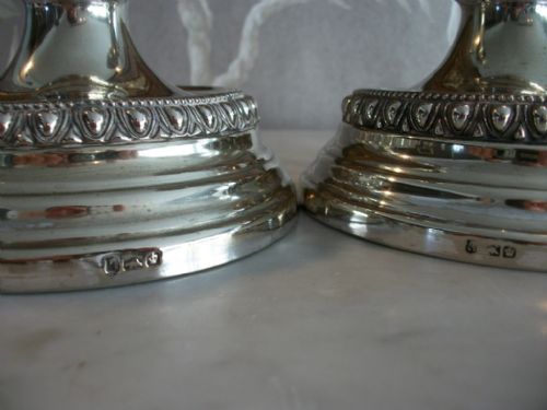 A PAIR OF SUBSTANTIAL SILVERPLATED CANDLESTICKS - ADDITIONAL PHOTO 1