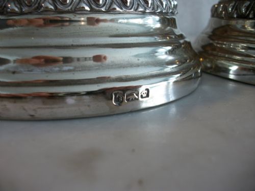 A PAIR OF SUBSTANTIAL SILVERPLATED CANDLESTICKS - ADDITIONAL PHOTO 2