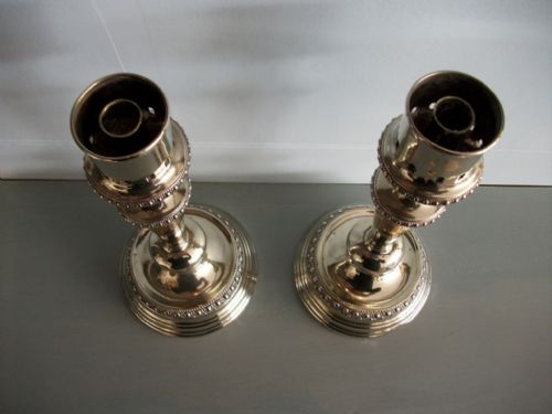 A PAIR OF SUBSTANTIAL SILVERPLATED CANDLESTICKS - ADDITIONAL PHOTO 3