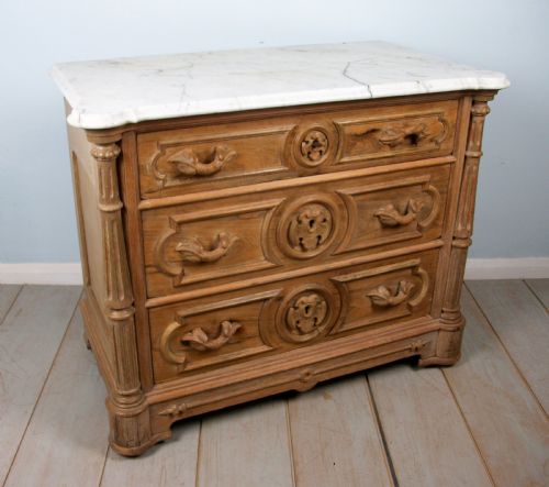 a small 19th century carved french chest of drawers - CATEGORY: ANTIQUE CHEST OF DRAWERS - DATED 19TH CENTURY