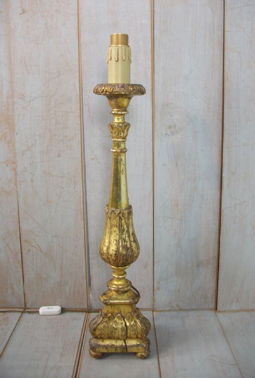 an italian carved and gilded candlestick - CATEGORY: ANTIQUE LIGHTING - DATED 18TH CENTURY
