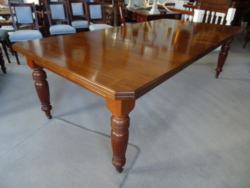 A LARGE VICTORIAN EXTENDING WIND OUT WALNUT DINING TABLE - ADDITIONAL PHOTO 4