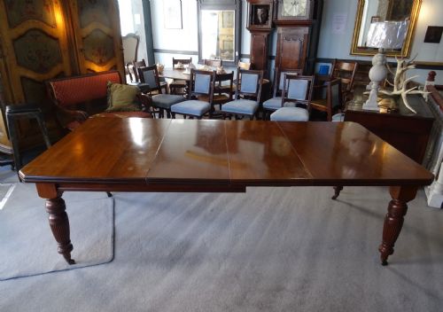 A LARGE VICTORIAN EXTENDING WIND OUT WALNUT DINING TABLE - ADDITIONAL PHOTO 6