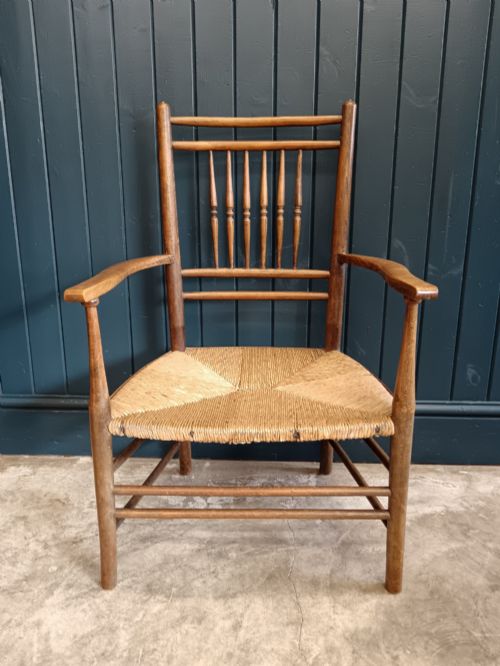 LATE 19TH CENTURY ARTS CRAFTS 'SUSSEX' FIRESIDE ARMCHAIR WITH SPINDLE BACK RUSH SEAT - ADDITIONAL PHOTO 1