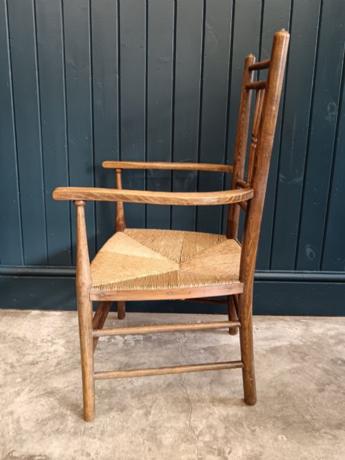 LATE 19TH CENTURY ARTS CRAFTS 'SUSSEX' FIRESIDE ARMCHAIR WITH SPINDLE BACK RUSH SEAT - ADDITIONAL PHOTO 3