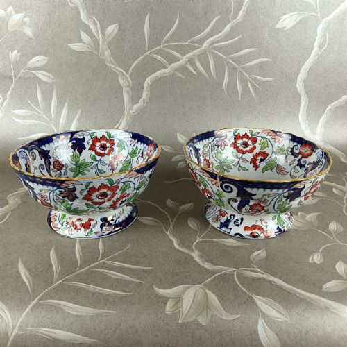 fig 1. A pair of 19th-century Minton ironstone pedestal bowls with scalloped rims and vibrant Amherst Japan floral transfer pattern in cobalt blue, orange, and green.