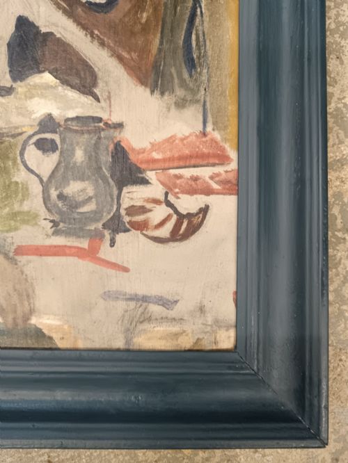 fig 1. A mid-twentieth-century modernist oil painting on card depicting a bearded man in a green jacket seated in an artist studio, presented in a dark blue wooden frame.