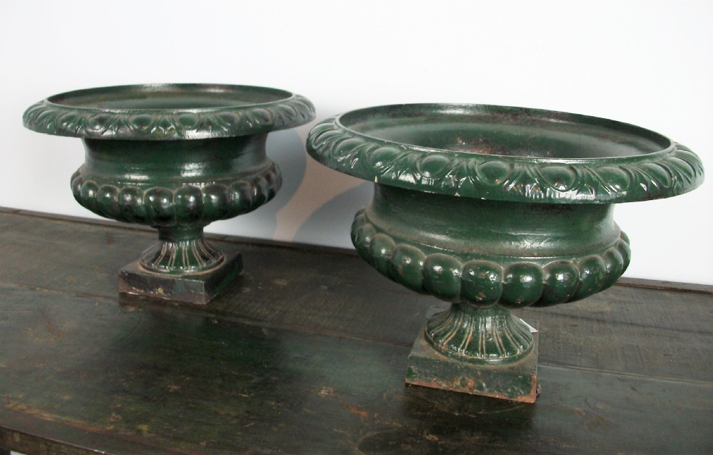 Pair of elegant cast iron urns