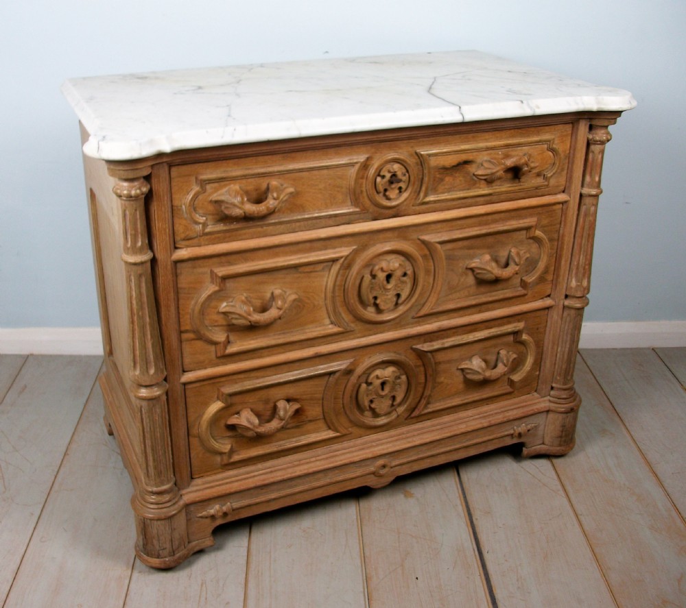 A small 19th Century Carved French Chest of Drawers