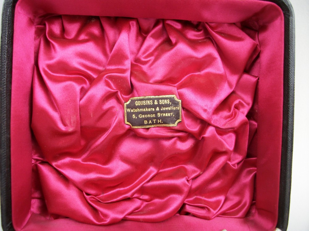 A set of four late Victorian silver-plated knife rests with mother-of-pearl central shafts displayed in an open silk-lined presentation box. View V