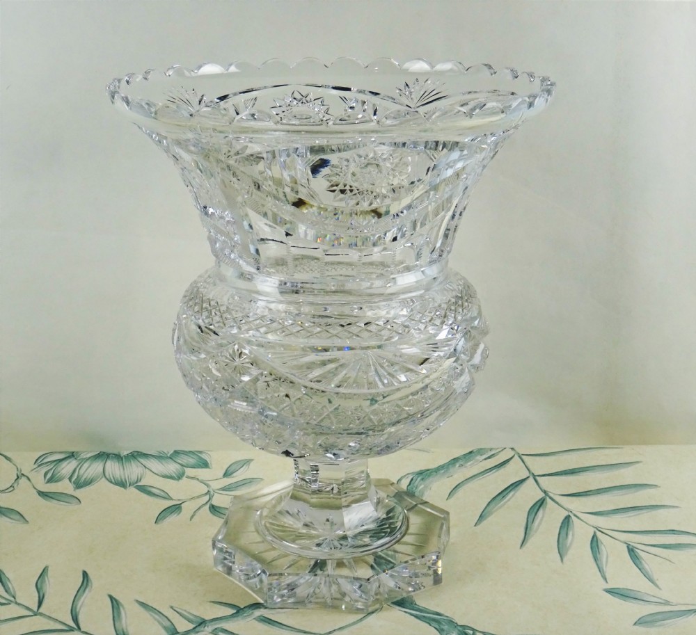 A large cut-glass centre table of campana design