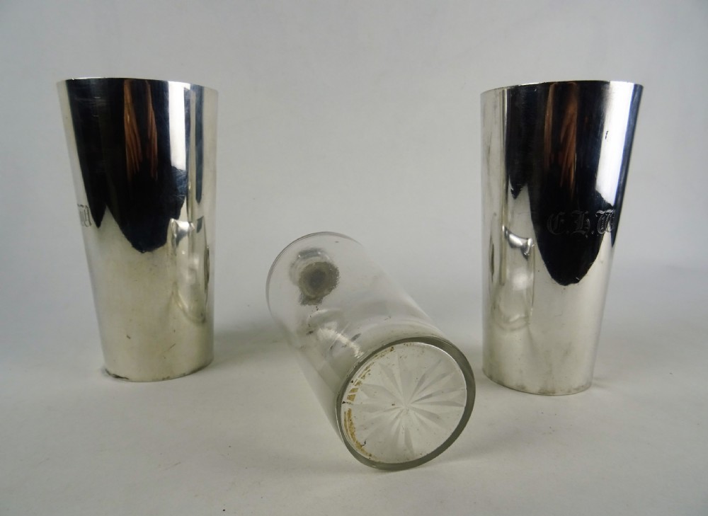 A nineteenth-century glass spirit flask encased in a dark brown leather carrying case with a leather shoulder strap and silver-toned metal cap. View XIII