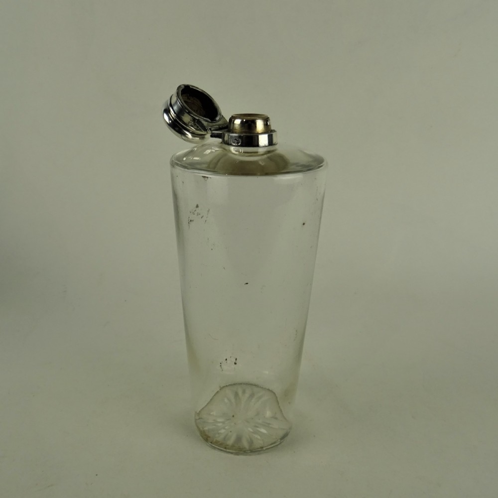 A nineteenth-century glass spirit flask encased in a dark brown leather carrying case with a leather shoulder strap and silver-toned metal cap. View IV