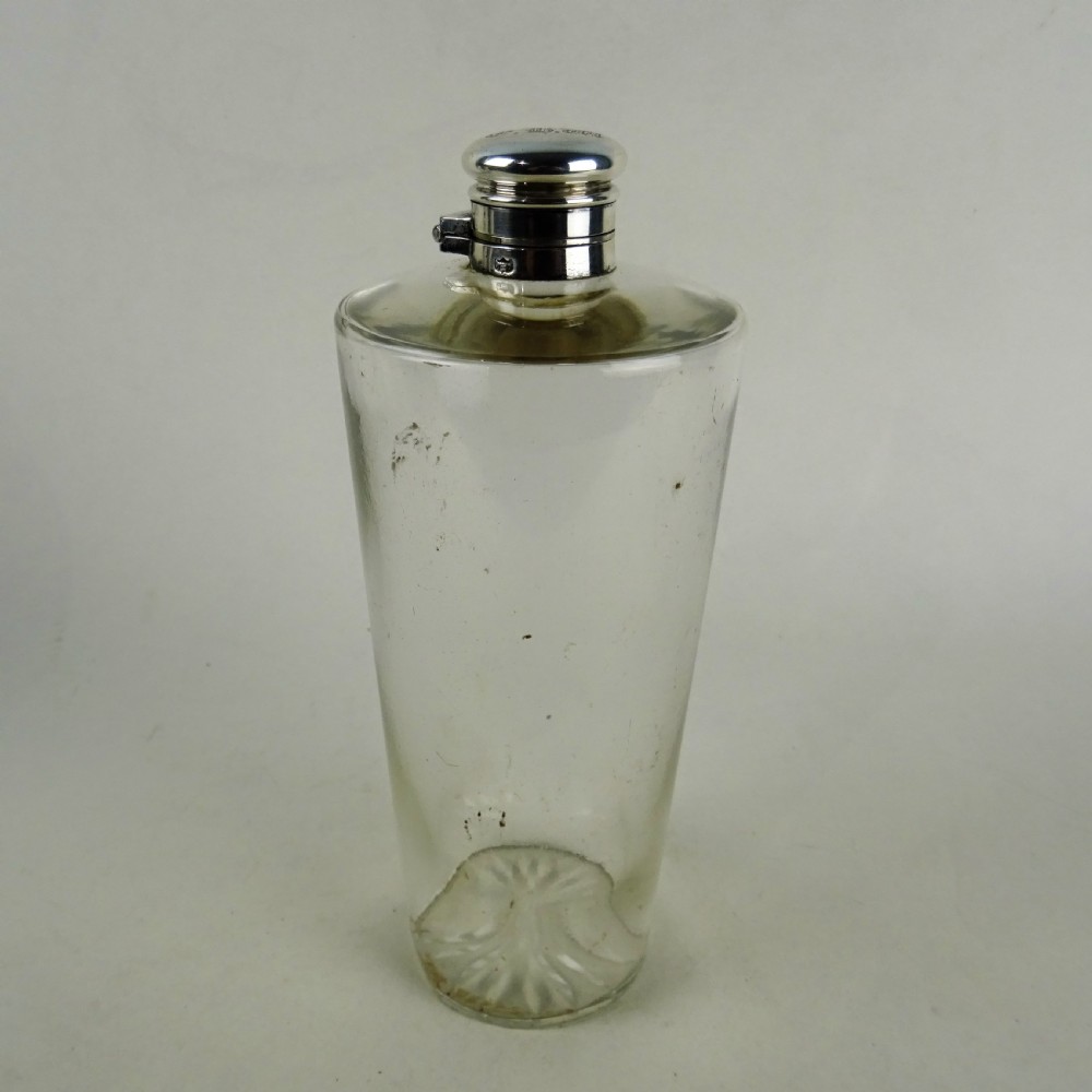 A nineteenth-century glass spirit flask encased in a dark brown leather carrying case with a leather shoulder strap and silver-toned metal cap. View III