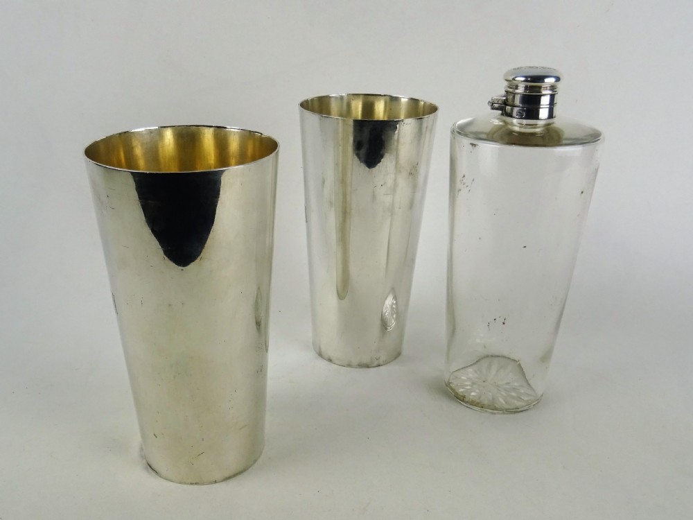 A nineteenth-century glass spirit flask encased in a dark brown leather carrying case with a leather shoulder strap and silver-toned metal cap. View VI
