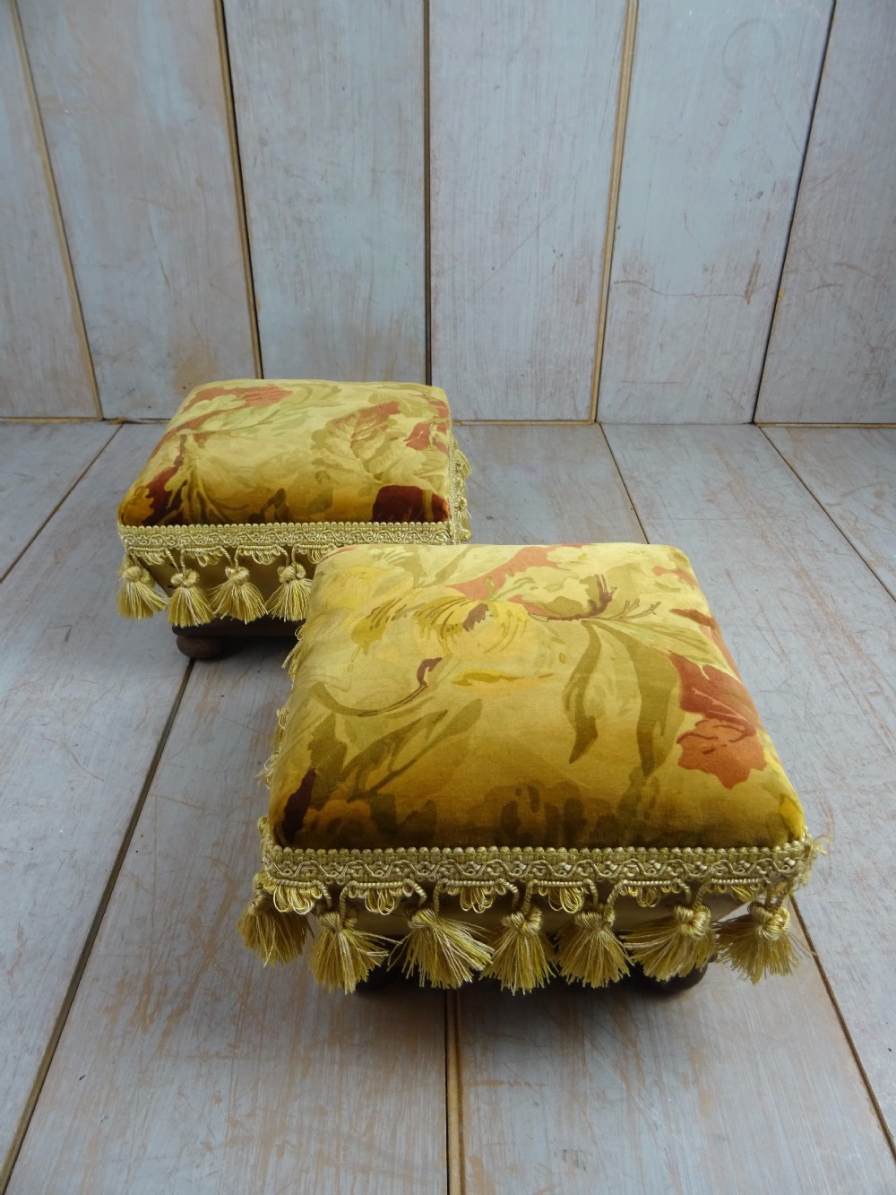 Pair of small upholstered footstools