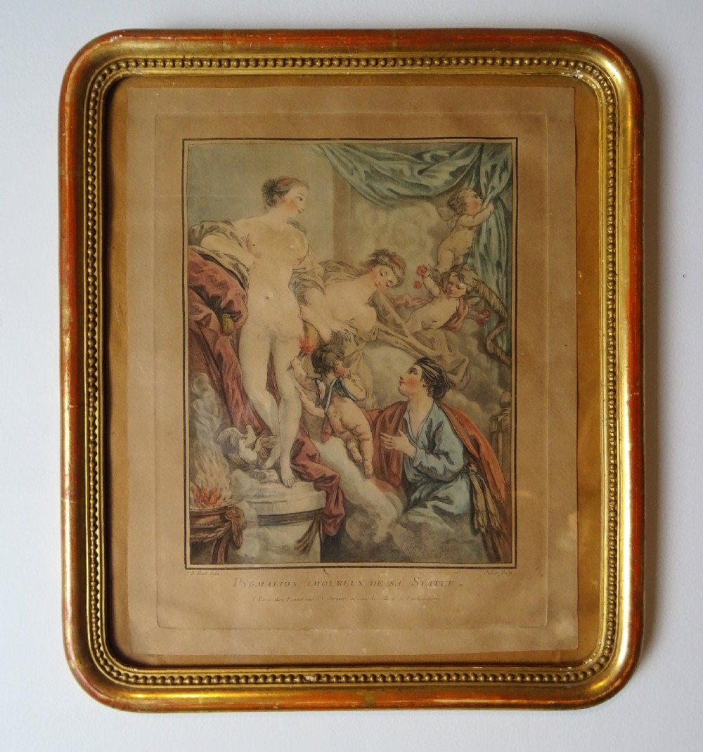 An antique gilt-framed print depicting the classical myth of Pygmalion and Galatea with French text along the bottom margin.