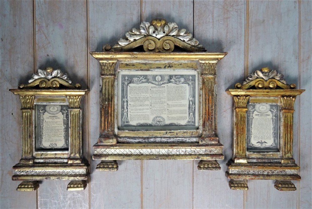A set of three antique Italian giltwood cartagloria altar frames with architectural pilasters and hand-carved crestings enclosing printed Latin liturgical texts. View XIV