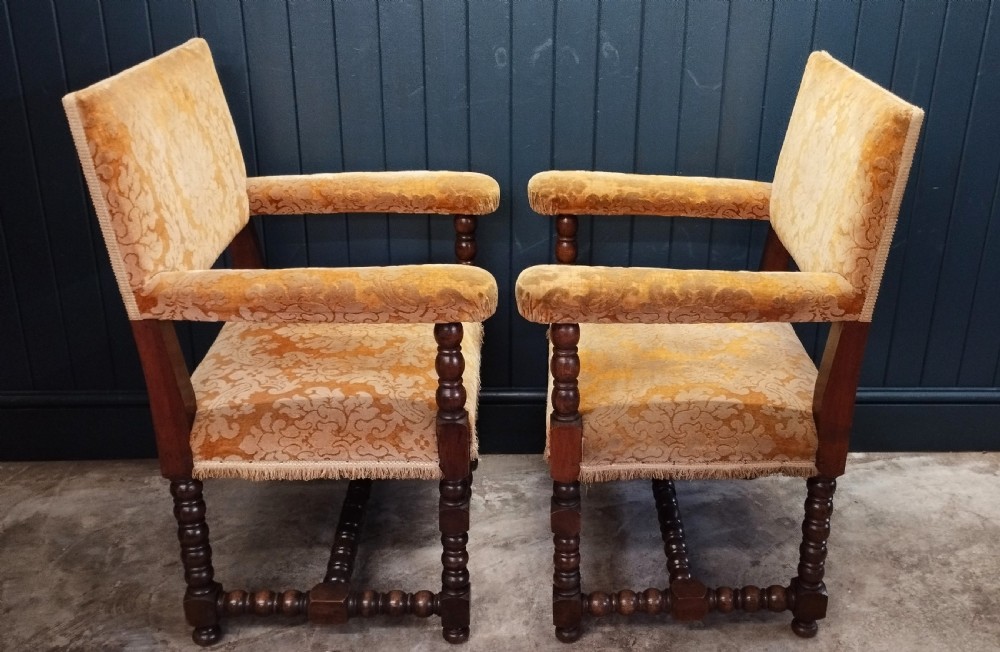 A pair of Italian style open armchairs with dark bobbin turned frames and gold damask upholstery with fringe trim. View VI