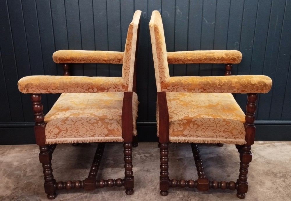 A pair of Italian style open armchairs with dark bobbin turned frames and gold damask upholstery with fringe trim. View II