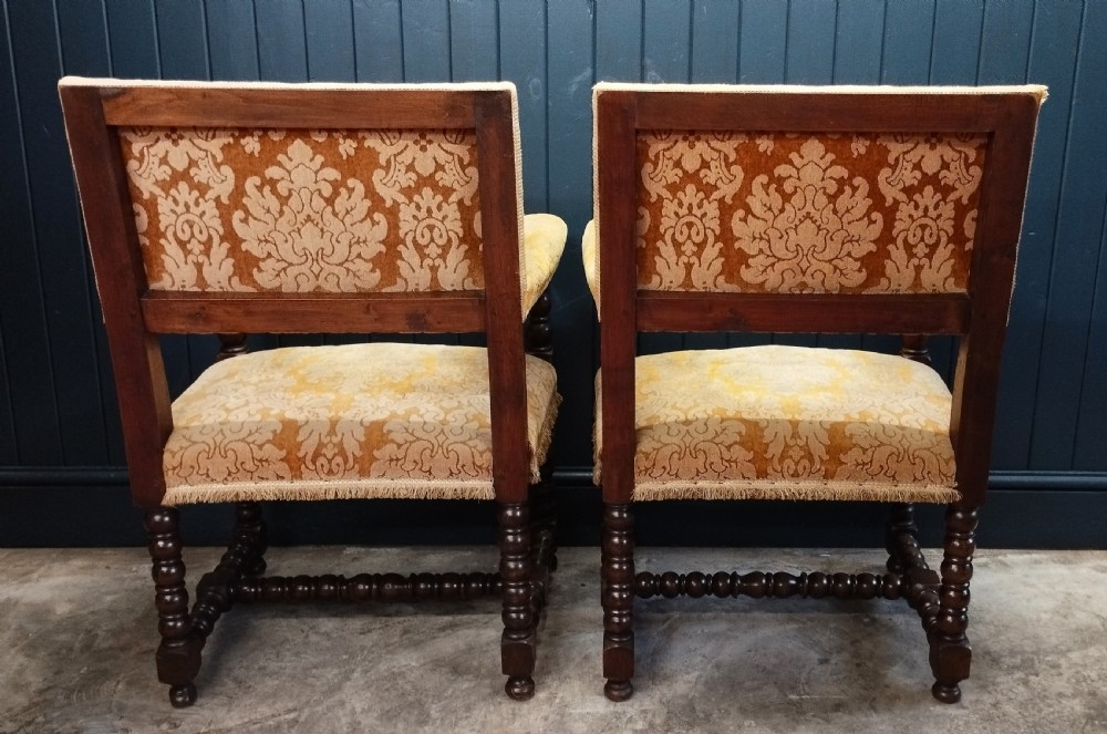 A pair of Italian style open armchairs with dark bobbin turned frames and gold damask upholstery with fringe trim. View III