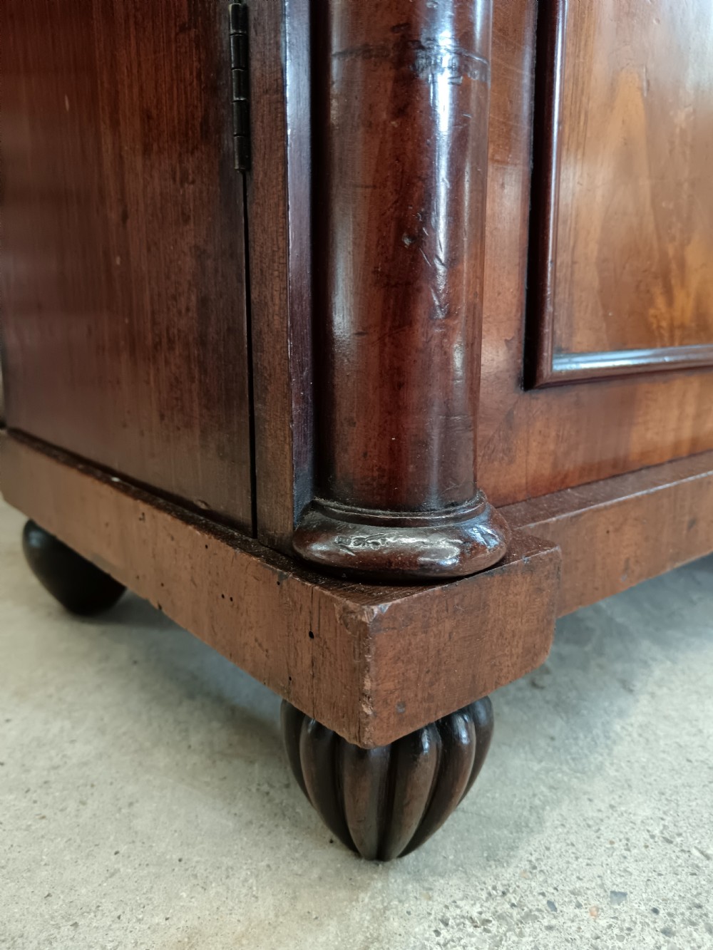 A Regency mahogany chiffonier featuring a two-tier open shelf superstructure above a two-door lower cabinet with arched panel doors and turned columns. View IX